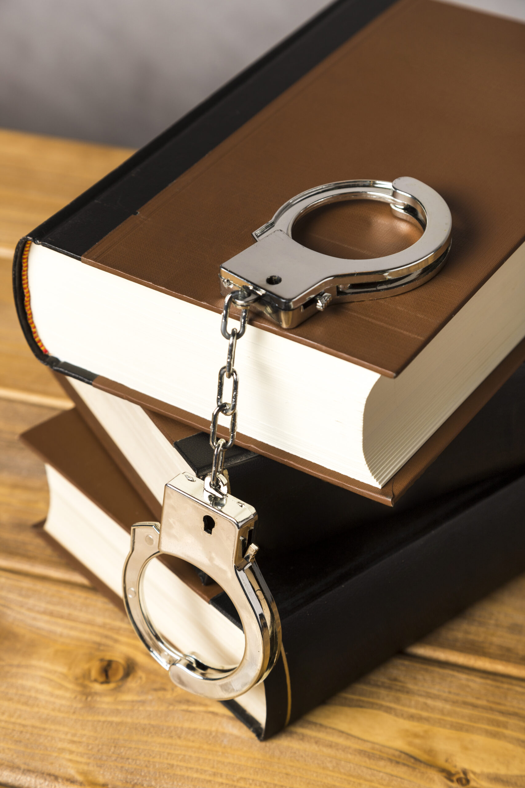 close up with handcuffs books